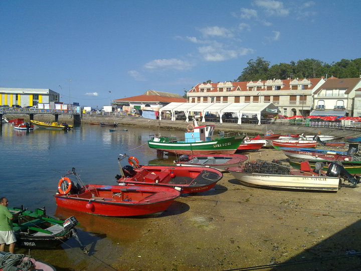 The Illa de Arousa harbour on a calm sea
